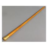 A yellow metal (tests as 18ct gold) Malacca cane,