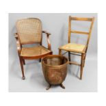 A cane armchair twinned with a chair bedroom chair & a cane basket