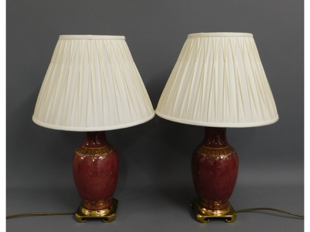 A modern pair of lamps with brass plinth, 25in hig