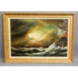 A gilt framed stormy seascape oil by Arthur Read,