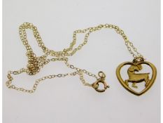 A 9ct gold chain with ram pendant, 0.7g