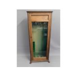 A glazed oak gun cabinet with claw feet, 61.5in hi