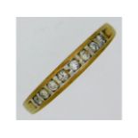 A yellow metal, tests as 9ct gold, half eternity ring set with 0.25ct diamond, 1.93g, size T