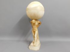 An art deco style alabaster lamp featuring Atlas,