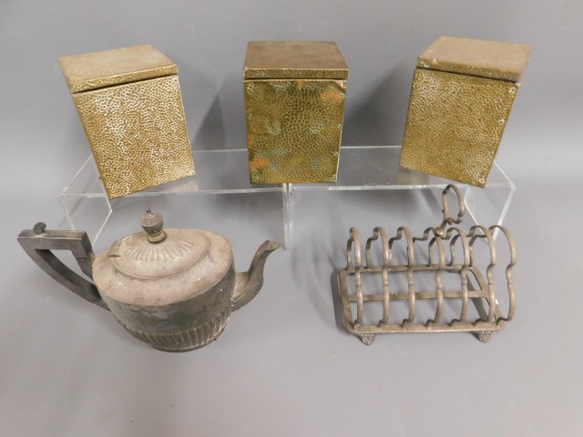 Three brass plated, tin lined caddies, a silver pl