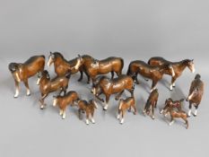 A herd of Beswick horses, 14 in total, tallest 7.5