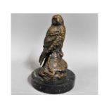 A marble mounted bronze bird of prey, 6.25in tall