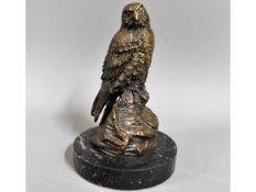 A marble mounted bronze bird of prey, 6.25in tall