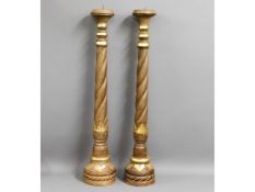 A pair of large decorative church candle holders w