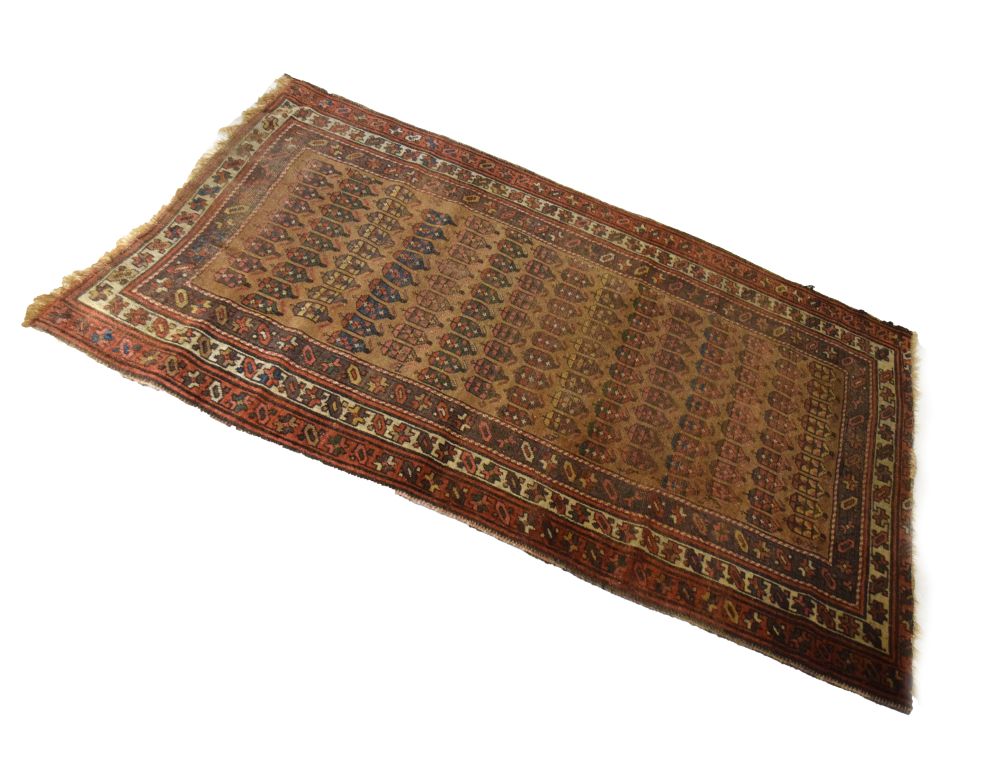 Middle Eastern wool rug, the pale brown field with allover polychrome boteh within multi borders,