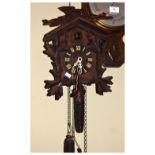 20th Century Black Forest style cuckoo clock having carved oakleaf decoration and Roman numeral