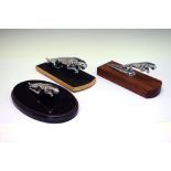 Three Jaguar style car mascots mounted on wooden plinths as paperweights Condition: Some light