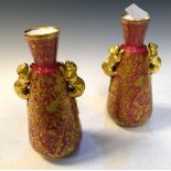 Pair of Royal Crown Derby baluster vases, having gilt floral decoration on a magenta ground, applied