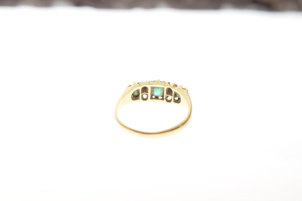 Yellow metal dress ring set three green and four small white stones, the shank stamped 18ct, size P, - Image 3 of 5