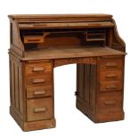 Early 20th Century oak tambour-front twin pedestal desk, 121cm x 68cm x 119cm high Condition: