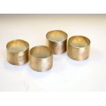 Set of four George VI silver napkin rings with engine turned decoration, sponsors mark of Edward