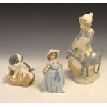Three Spanish porcelain figures including Nao girl with goat, 30cm high, puppy and Lladro girl (3)