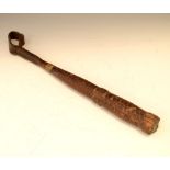 Carved wooden truncheon or cosh imitating plaited leather, 37cm long Condition: Wear to the end,