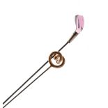 Two large hat pins, one formed as a golf club driver, 32.5cm long Condition: Some chips to the