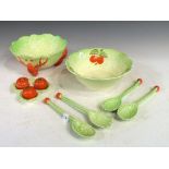 Two Crown Devon leaf bowls, together with a cruet set and two pairs of servers, bowl diameter 23cm