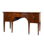19th Century and later mahogany serpentine front sideboard with three drawers, each with lion head