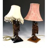 Two Oriental carved wood figural table lamps, largest 55cm high with shade Condition: Both appear to