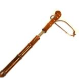 Bamboo walking stick having shield escutcheon with brass Ferrule, 91cm long Condition: Splits to the