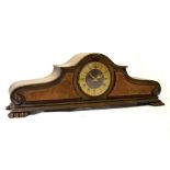 Early 20th Century walnut cased mantel clock, standing on four paw feet, 81cm wide x 28.5cm high