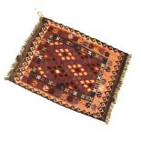 20th Century flat-woven kilim rug, red field with allover stepped lozenge decoration, 93cm x 76cm