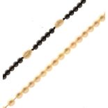 Cultured pearl necklace with yellow metal clasp stamped 9ct, 39cm long, together with a pearl and