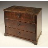 Early 19th Century oak table-top chest of three drawers, standing on four bracket feet, 33cm x