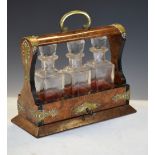 Victorian figured walnut three-bottle cruet tantalus, 23cm x 25cm Condition: Some surface wear/