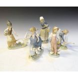 Five Lladro porcelain figure groups of girls with ducks Condition: Some petals have snapped off. **