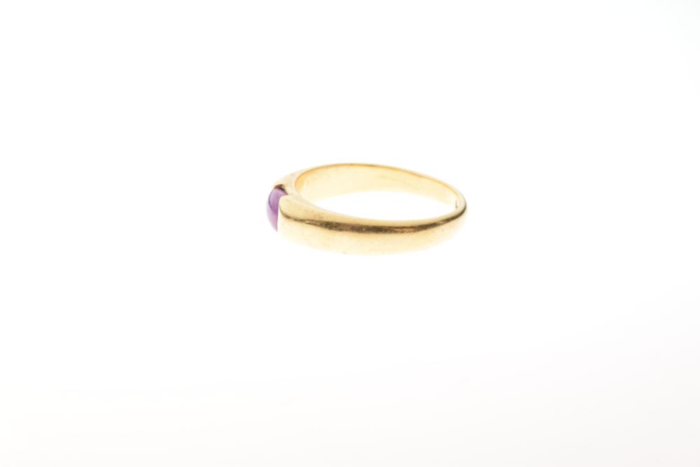 Yellow metal dress ring, the plain band set pink oval cabochon, shank stamped 18k, size Q½, 5.4g - Image 2 of 5