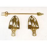 Pair of early 20th Century brass trivet iron stands, having pierced decoration of a British military