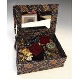 Vanity case containing a assorted of costume jewellery to include; chains, pendants, mesh purse,