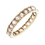 Unmarked yellow metal eternity ring set white stones, size M, 2.2g gross approx Condition: Light
