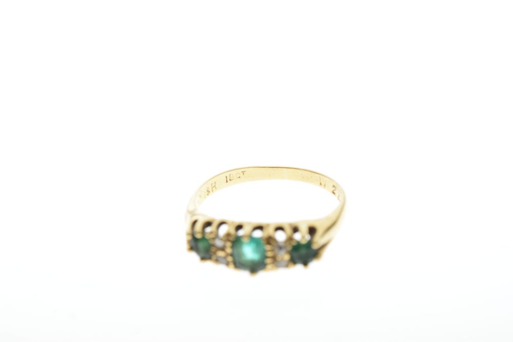 Yellow metal dress ring set three green and four small white stones, the shank stamped 18ct, size P, - Image 5 of 5