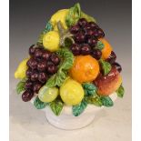 Late 20th Century pottery table centre in the form of a bowl and fruit, 31cm high Condition: Some