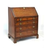 19th Century oak and mahogany bureau, the hinged fall opening to reveal a fitted interior, 112cm x