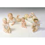 Four porcelain piano dolls Condition: All would benefit from a clean, loss of decoration in