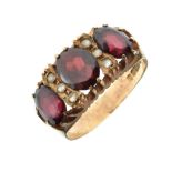 9ct gold dress ring set three red garnet-coloured stones and small white stones, size P, 4.2g
