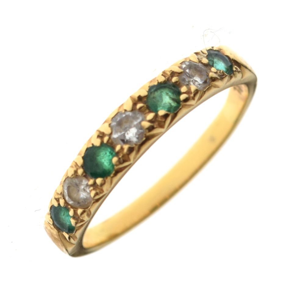 Yellow metal emerald and diamond seven-stone dress ring, shank stamped 18ct, size P½, 2.9g gross