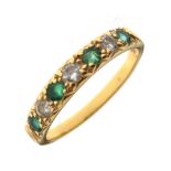 Yellow metal emerald and diamond seven-stone dress ring, shank stamped 18ct, size P½, 2.9g gross