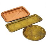 Two Middle Eastern/Indian brass trays, together with a copper rectangular meat draining dish