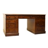 Victorian mahogany twin pedestal desk fitted nine drawers and having turned handles, the top