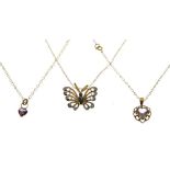 9ct gold butterfly pendant, together with two heart-shaped pendants, each set amethyst-coloured