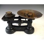 Cast iron and brass kitchen scales with a quantity of weights, 20cm high approx Condition: Surface
