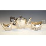 Matched Neo-classical three piece tea set, the teapot dated Birmingham 1903 and standing 12.5cm