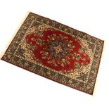 Machine-made wool rug, crimson field with Persian-style foliate decoration, 238cm x 158cm Condition: